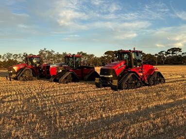 A group of tractors in a field

AI-generated content may be incorrect.
